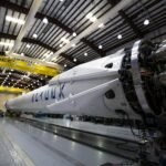 A dramatic SpaceX rocket launch representing the multi-billion dollar SpaceX Buys Cursor technology acquisition.